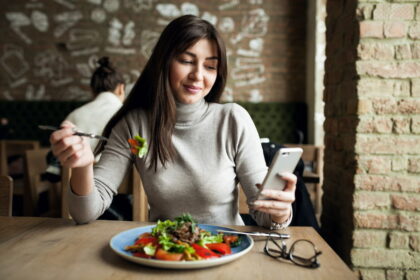 A girl is eating in Vegan Café