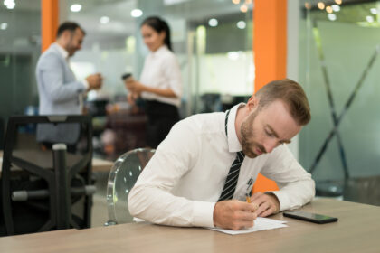 Focused young man working on absence management